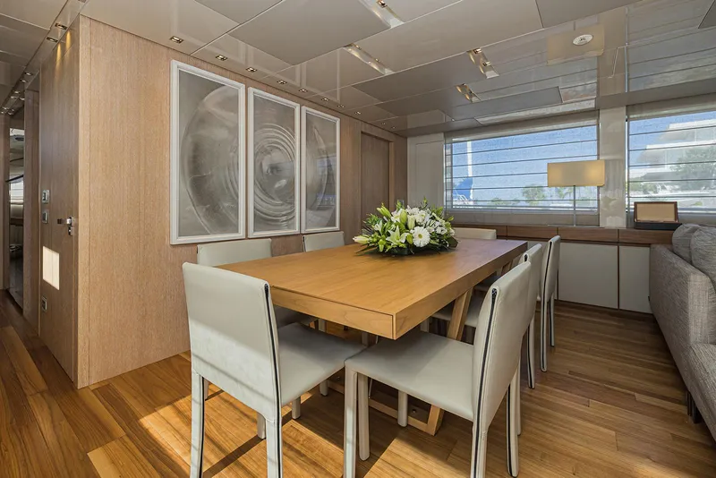 Slide: The Image of Luxurious dining area on 2014 Sanlorenzo SL104 yacht with elegant decor and wooden flooring. - 21