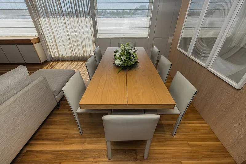 Slide: The Image of Dining area on 2014 Sanlorenzo SL104 yacht with elegant table and chairs. - 22