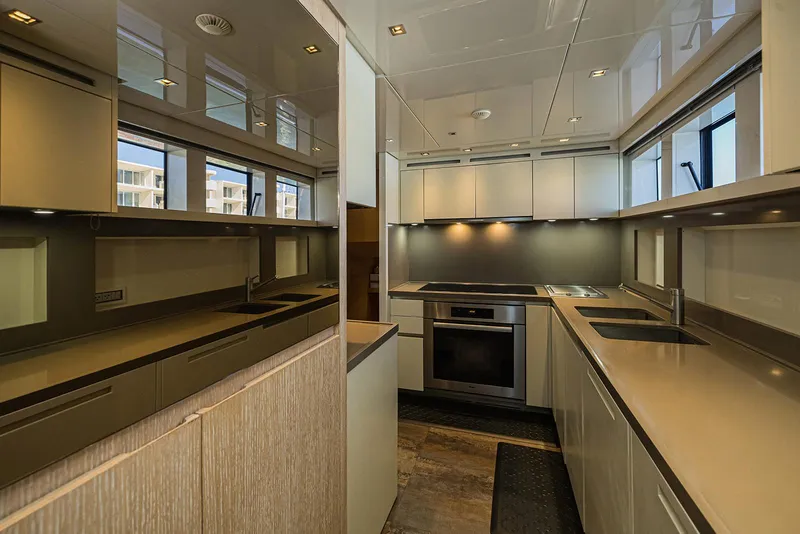 Slide: The Image of Modern kitchen interior on 2014 Sanlorenzo SL104 yacht, featuring sleek cabinetry and stainless steel appliances. - 24
