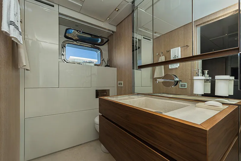 Slide: The Image of Luxurious bathroom in 2014 Sanlorenzo SL104 yacht with modern fixtures and wooden accents. - 29