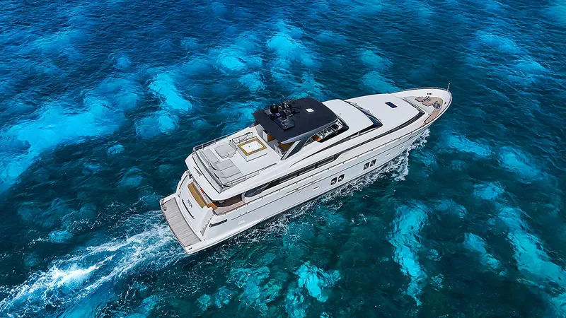 Slide: The Image of Sanlorenzo SL104 yacht cruising on vibrant blue ocean waters, 2014 model. - 8