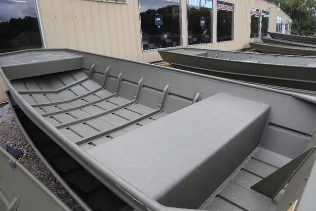 Slide: The Image of 2023 Lowe 1448MT NCS 20" boat displayed outside a store. - 3