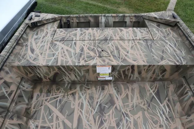 Slide: The Image of 2025 Lowe Roughneck 1760 Tiller boat with camouflage pattern, viewed from above. - 4