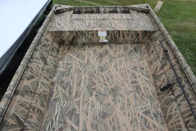 Slide: The Image of 2025 Lowe Roughneck 1760 Tiller boat with camouflage interior design. - 7