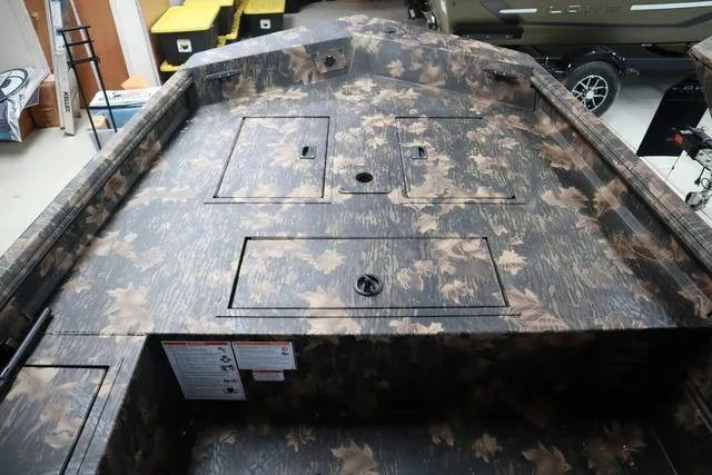 Slide: The Image of 2024 Lowe Roughneck 1760 boat with camo pattern and add-on console. - 5