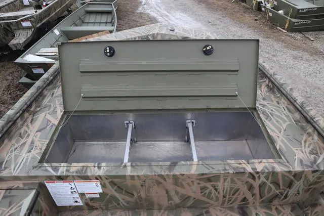 Slide: The Image of 2025 Lowe 2070 boat with add-on console, featuring open storage compartment. - 9