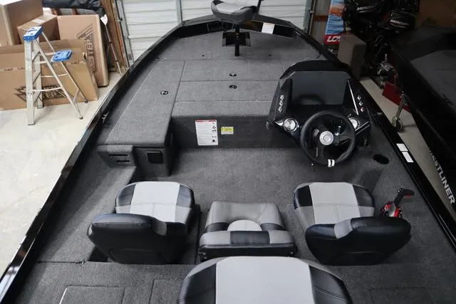 Slide: The Image of 2025 Crestliner XF 17 BASS boat interior with seating and steering console. - 3