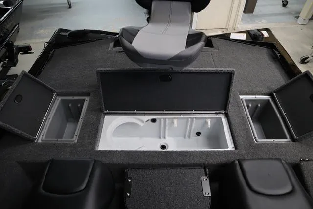 Slide: The Image of 2025 Crestliner XF 17 BASS boat interior with storage compartments and seating. - 4