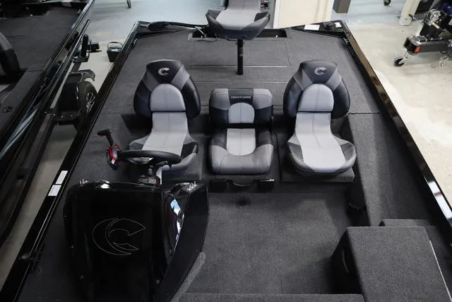Slide: The Image of 2025 Crestliner XF 17 BASS boat interior with three seats and steering console. - 5