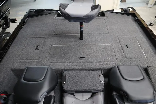 Slide: The Image of 2025 Crestliner XF 17 BASS boat interior with seating and storage compartments. - 6