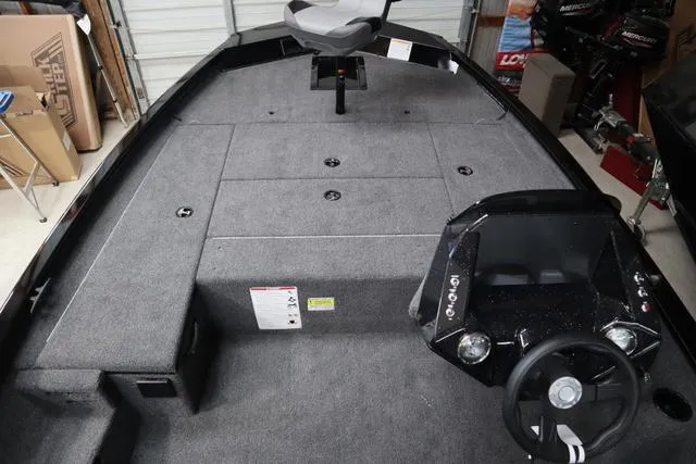 Slide: The Image of 2025 Crestliner XF 17 BASS boat interior with steering console and seating. - 8