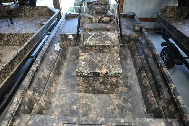 Slide: The Image of 2024 Lowe Roughneck 1860 CC boat with camouflage interior design. - 6