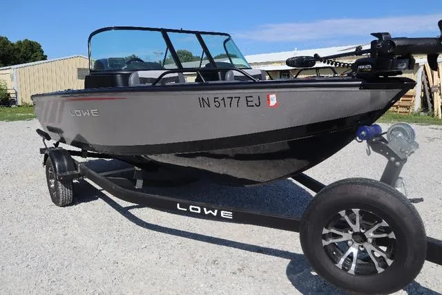 Slide: The Image of 2022 Lowe FS 1700 Fish & Ski boat on trailer, parked outdoors. - 4