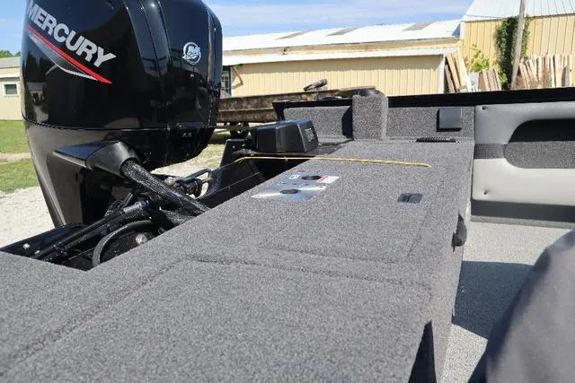 Slide: The Image of 2022 Lowe FS 1700 Fish & Ski boat with Mercury engine, featuring spacious deck. - 7