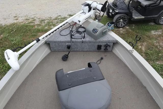 Slide: The Image of 1998 Tracker Pro Angler V16 SC boat interior with fishing equipment and trolling motor. - 4