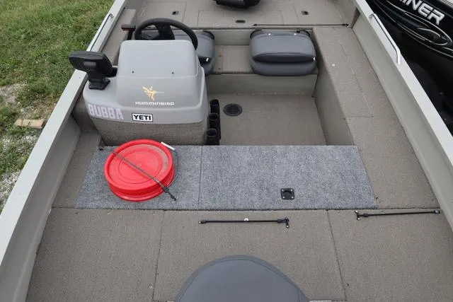 Slide: The Image of 1998 Tracker Pro Angler V16 SC boat interior with steering console and seating. - 6