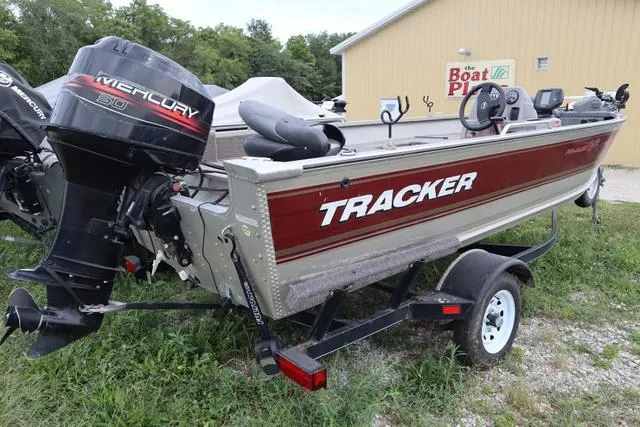 Slide: The Image of 1998 Tracker Pro Angler V16 SC boat with Mercury engine on trailer. - 9