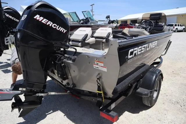 Slide: The Image of 2008 Crestliner 1600 Fish Hawk SC boat with Mercury engine on trailer. - 3