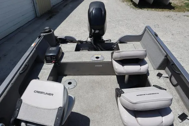 Slide: The Image of 2008 Crestliner 1600 Fish Hawk SC boat interior with seating and motor. - 8