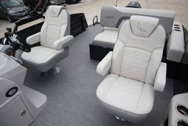 Slide: The Image of 2024 Lowe SS 230 DL boat interior with plush white seating and modern design. - 4
