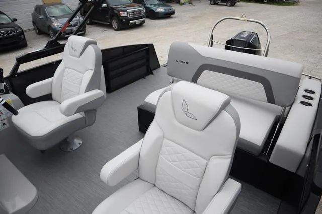 Slide: The Image of 2024 Lowe SS 230 DL Triple Tube boat interior with plush seating and modern design. - 9