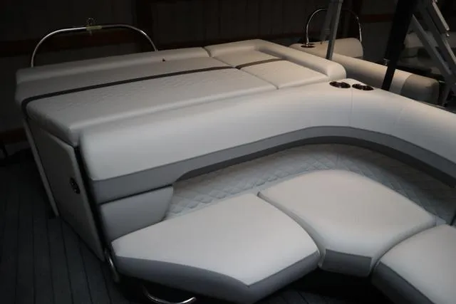Slide: The Image of 2023 Lowe SS 210 Triple Tube Package boat interior with plush seating and modern design. - 6