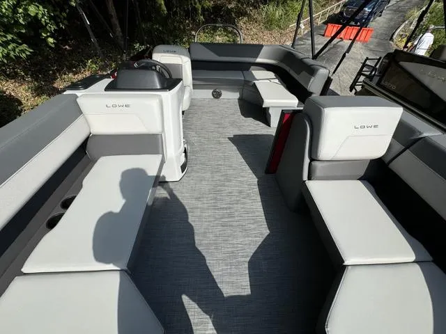 Slide: The Image of 2025 Lowe LS 170 boat interior with gray seating and modern design. - 3