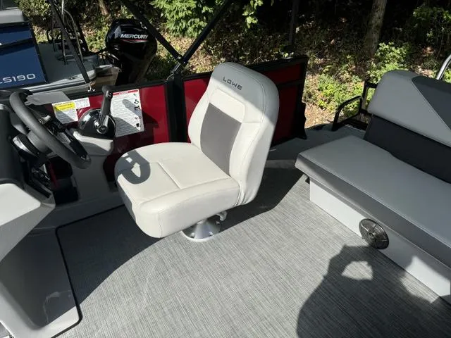Slide: The Image of Interior of 2025 Lowe LS 170 boat with seating and steering wheel. - 4