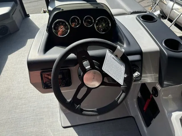 Slide: The Image of Steering console of 2025 Lowe LS 170 boat with gauges and controls. - 5