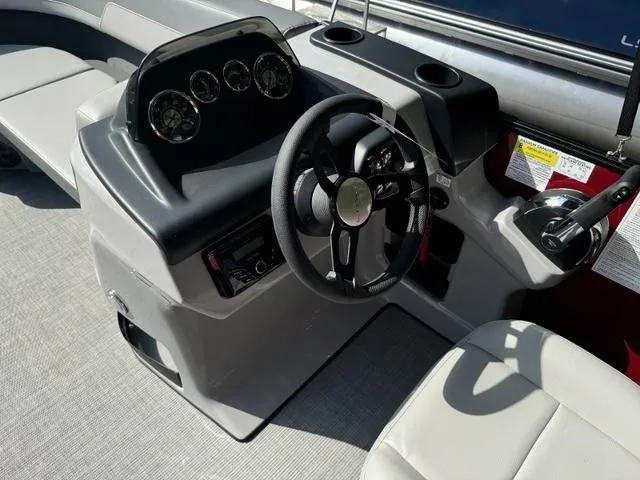 Slide: The Image of Steering console of 2025 Lowe LS 170 boat with modern controls and gauges. - 6