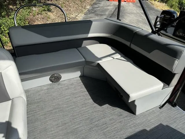 Slide: The Image of Modern seating area on 2025 Lowe LS 170 boat with gray upholstery. - 9