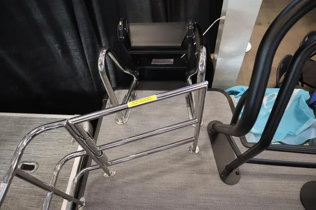 Slide: The Image of 2025 Godfrey Sweetwater 2286 SFL dashboard with controls and storage compartment. - 17