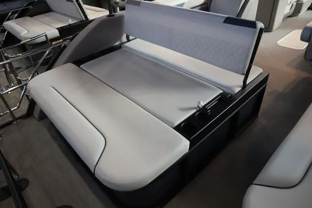 Slide: The Image of 2025 Godfrey Sweetwater 2286 SFL boat dashboard with steering wheel and control panel. - 18