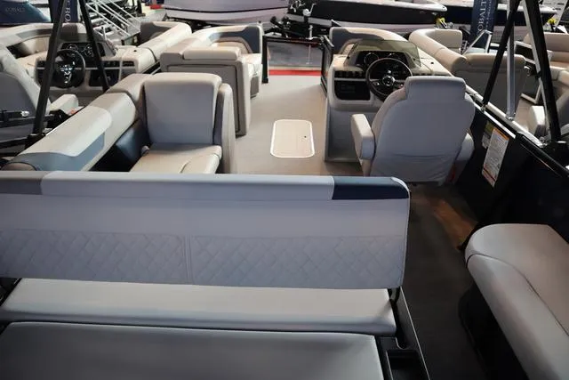 Slide: The Image of Interior of 2025 Godfrey Sweetwater 2286 SFL Triple Tube pontoon boat, featuring luxurious seating. - 19