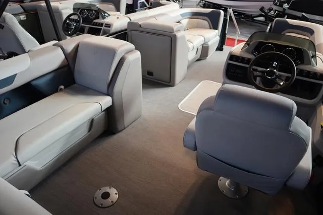 Slide: The Image of 2025 Godfrey Sweetwater 2286 SFL Triple Tube Package boat seating, beige and green upholstery. - 20