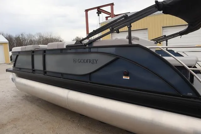 Slide: The Image of 2025 Godfrey Sweetwater 2286 SFL Triple Tube Package interior with luxurious seating and modern design. - 22