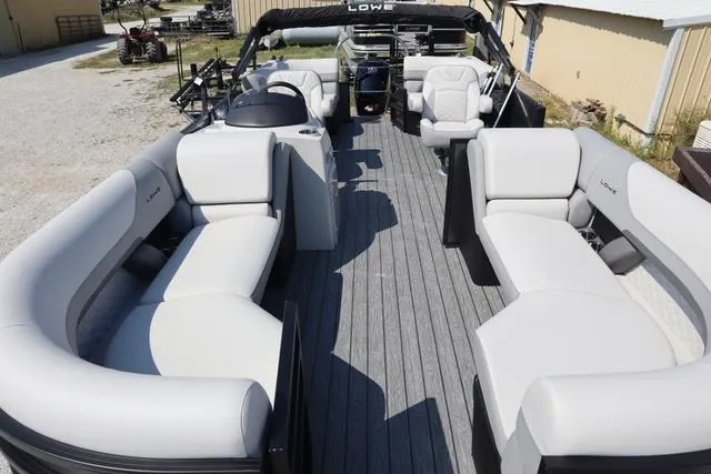 Slide: The Image of 2025 Lowe SS 230 WV Special Triple Tube pontoon boat with spacious seating and modern design. - 5