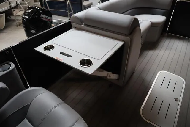 Slide: The Image of 2025 Bentley Pontoons Legacy 243 Swingback interior with seating and table, showcasing luxury design. - 10