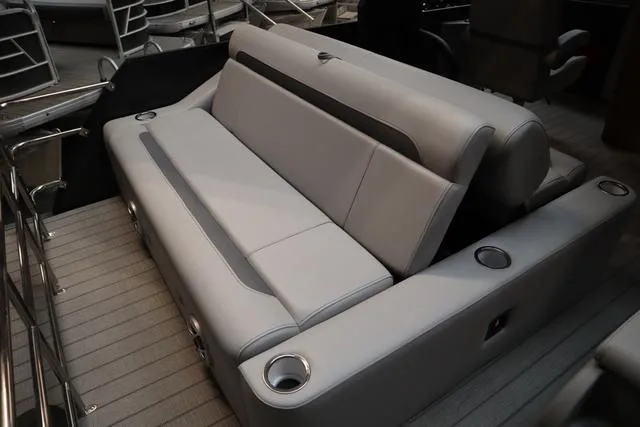 Slide: The Image of 2025 Bentley Pontoons Legacy 243 Swingback interior with sleek seating and cup holders. - 13