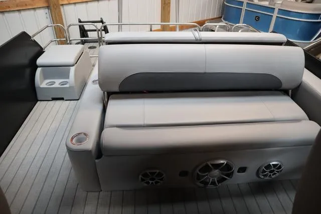 Slide: The Image of 2025 Bentley Pontoons Legacy 243 Swingback interior with plush seating and modern design. - 14