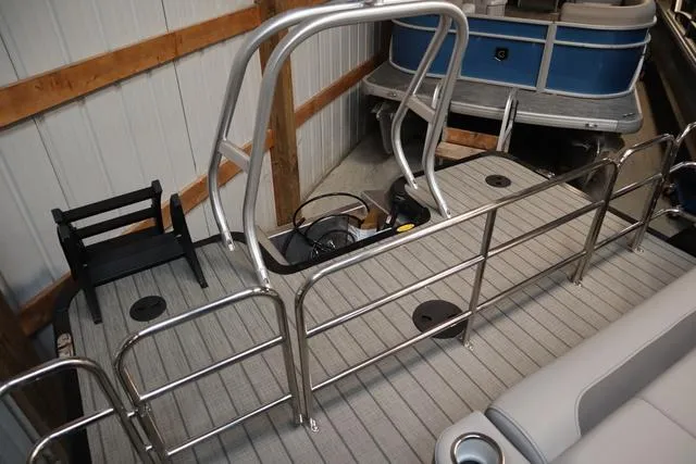 Slide: The Image of 2025 Bentley Pontoons Legacy 243 Swingback Ext. Triple Tube interior with sleek railing design. - 15