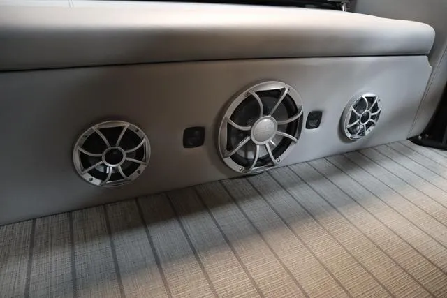 Slide: The Image of 2025 Bentley Pontoons Legacy 243 interior speakers on a striped floor. - 17