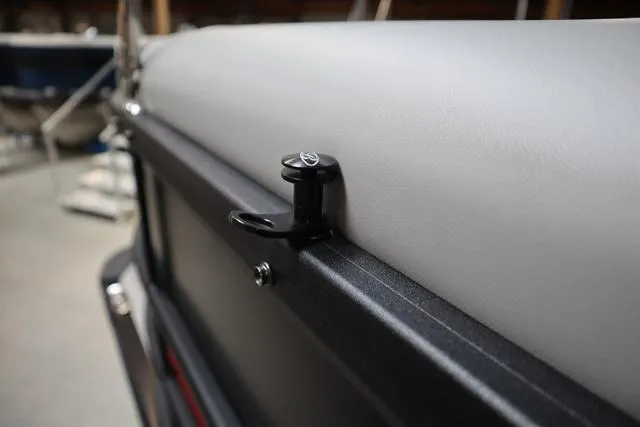 Slide: The Image of 2025 Bentley Pontoons Legacy 243 Swingback Ext. Triple Tube detail, featuring sleek upholstery and hardware. - 21