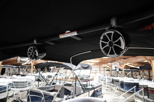 Slide: The Image of 2025 Bentley Pontoons Legacy 243 Swingback Ext. Triple Tube Pkg interior with speakers. - 22