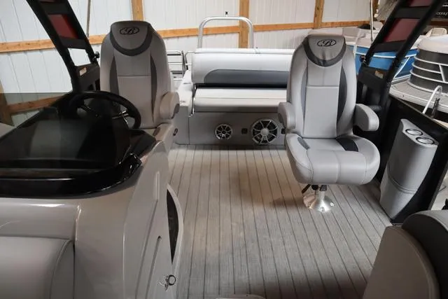 Slide: The Image of 2025 Bentley Pontoons Legacy 243 Swingback interior with modern seating and sleek design. - 25