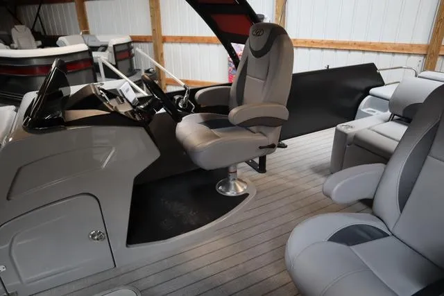 Slide: The Image of 2025 Bentley Pontoons Legacy 243 interior with modern seating and steering console. - 31