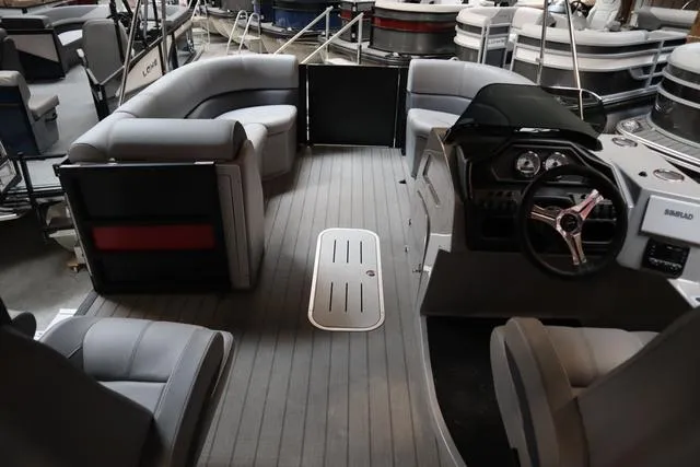 Slide: The Image of 2025 Bentley Pontoons Legacy 243 Swingback interior with modern seating and steering console. - 32
