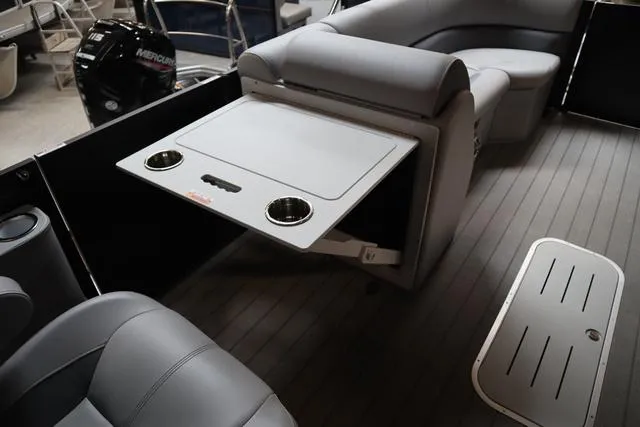 Slide: The Image of 2025 Bentley Pontoons Legacy 243 interior with swingback seating and table. - 34