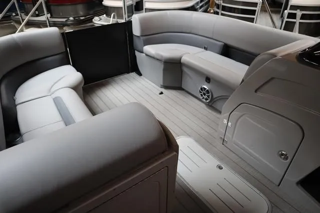 Slide: The Image of 2025 Bentley Pontoons Legacy 243 Swingback interior with gray seating and modern design. - 35