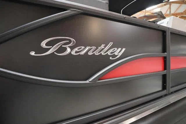 Slide: The Image of 2025 Bentley Pontoons Legacy 243 Swingback Ext. Triple Tube, sleek black and red design. - 40
